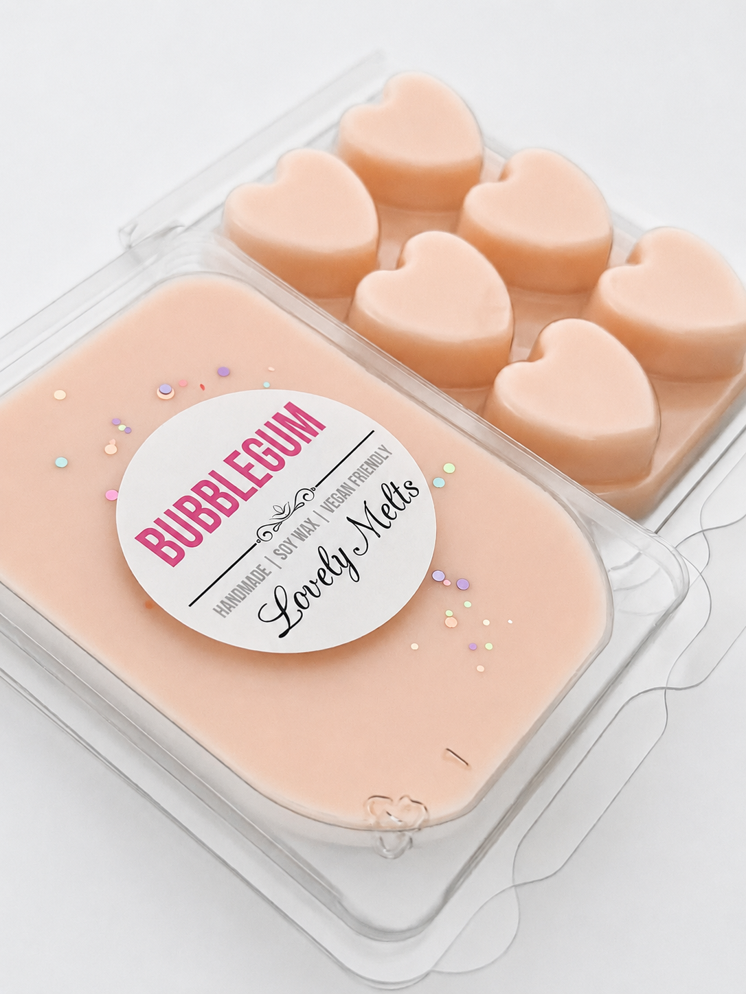 Heart-shaped bubblegum- SCENTED SOY WAX MELT BAR in a clear container with a 'Bubblegum Lovely Melts' label.