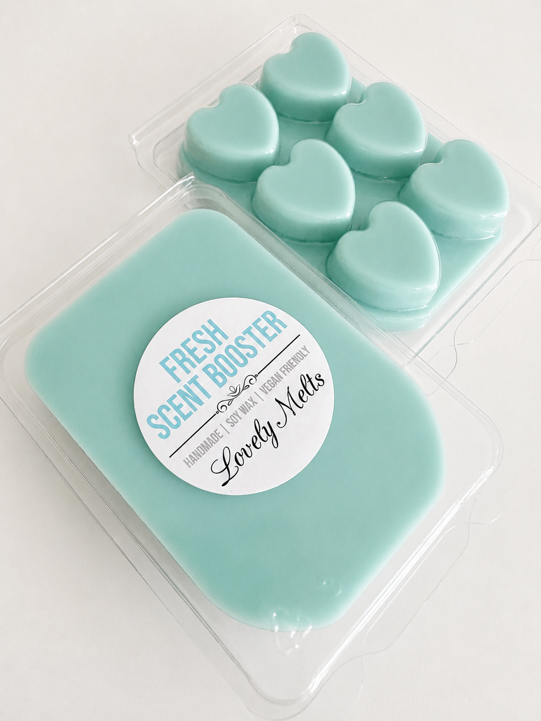 Packaged heart-shaped fresh scent booster wax melt bars with a lovely melts label on a white background
