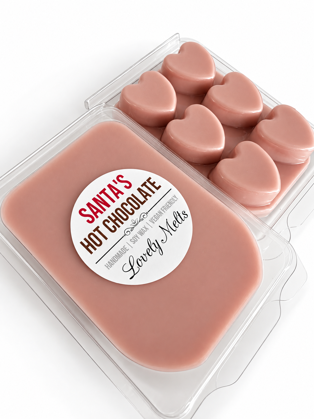 A package of heart-shaped hot chocolate wax melts in a clear plastic clamshell container. The label reads 'SANTA'S HOT CHOCOLATE' with 'Lovely Melts' underneath.