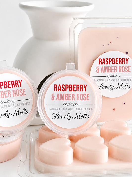 Packaging of Raspberry & Amber Rose scented wax melts with a white container.