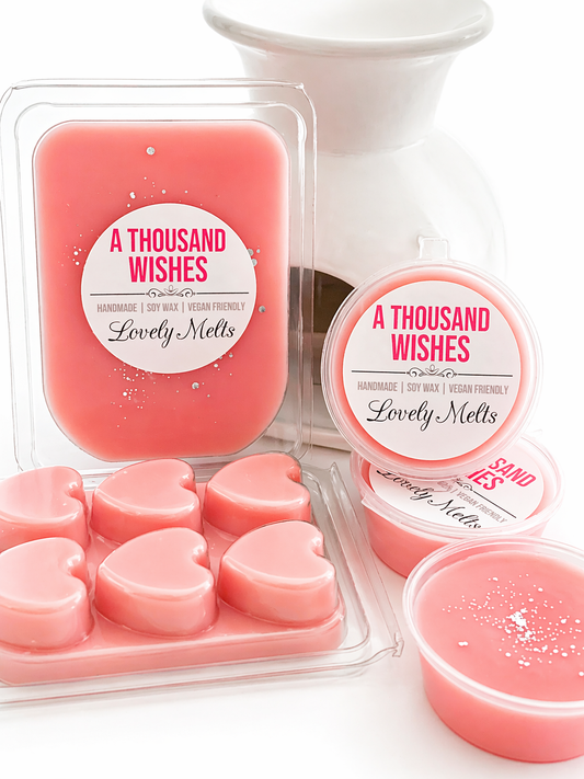 Pink wax melts packaging with 'A Thousand Wishes' branding on a white background