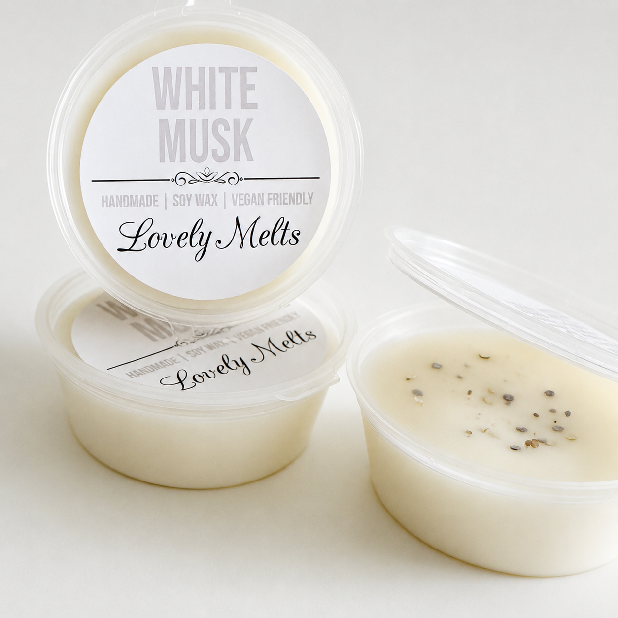 Two containers of 'White Musk' scented wax melts with 'Lovely Melts' branding on a white background.