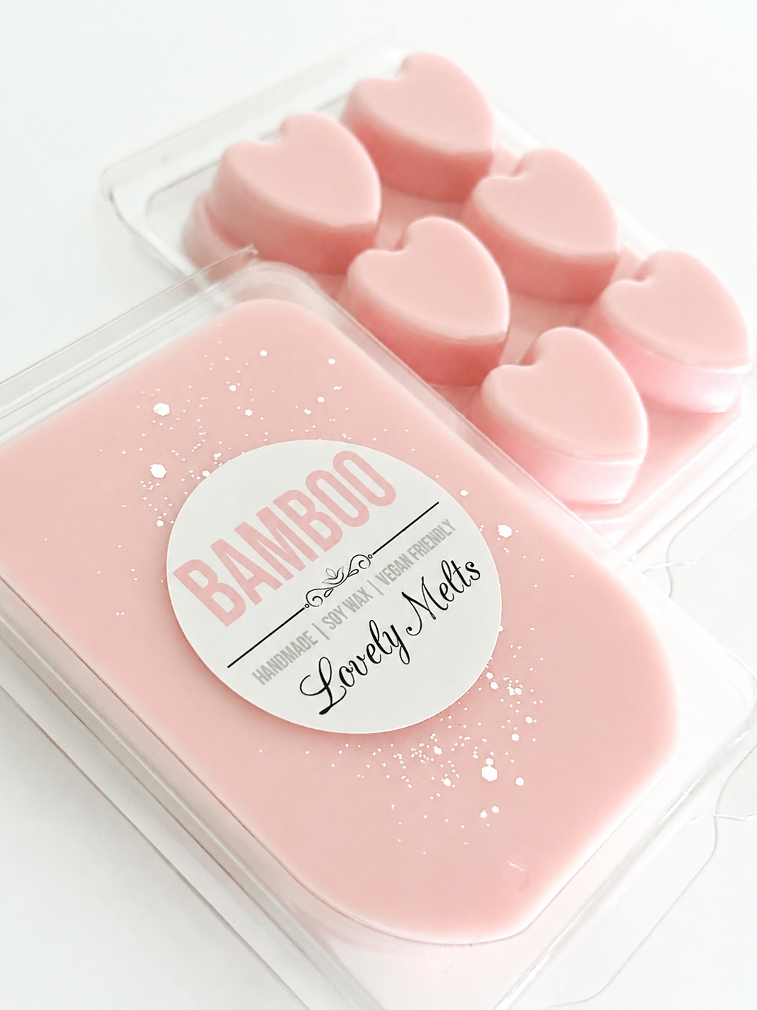 Pink heart-shaped wax melts in a container with 'Bamboo' branding on a white background