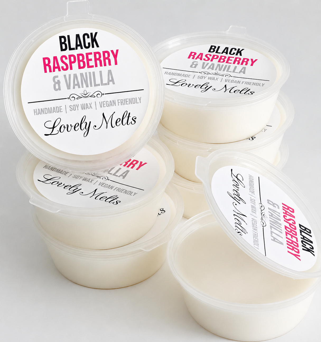White containers with 'Black Raspberry & Vanilla' labels on a light gray background soy wax melts