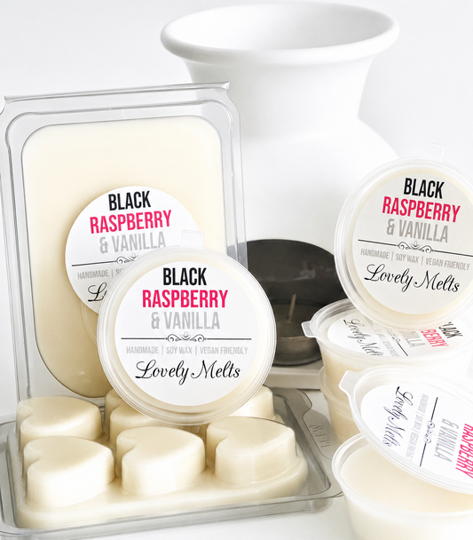 Black Raspberry & Vanilla Lovely Melts wax melts in packaging with a white wax burner and candle in the background