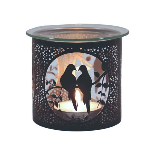 Candle warmer with cut-out design of two birds in a heart shape on a white background