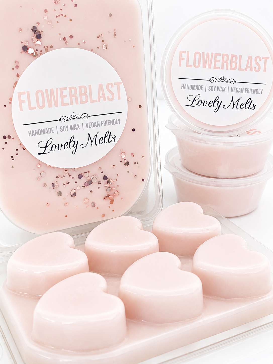 Heart-shaped wax melts with 'Flowerblast' packaging on a white background