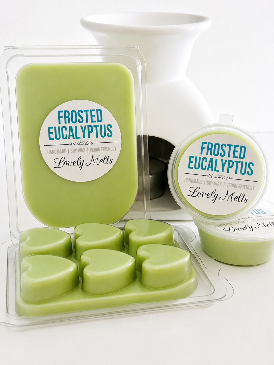 Green wax melts in a packaging with 'Frosted Eucalyptus' label on a white background