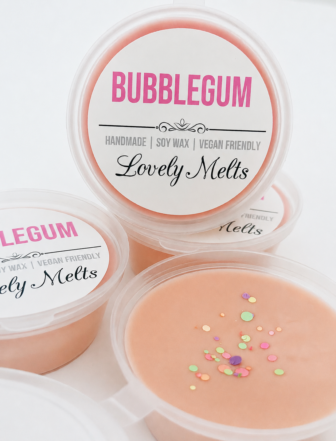 Bubblegum-scented wax melts in clear containers with 'Lovely Melts' branding.