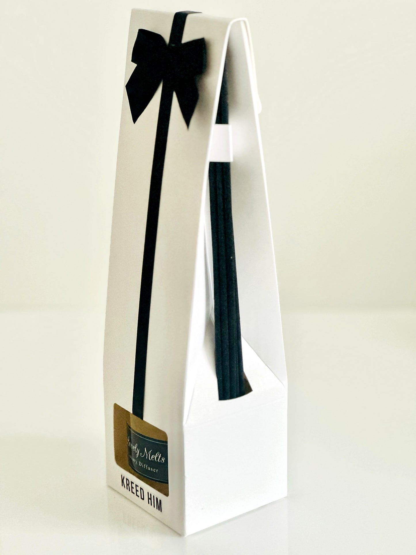 Gift bag with a black bow on a white background