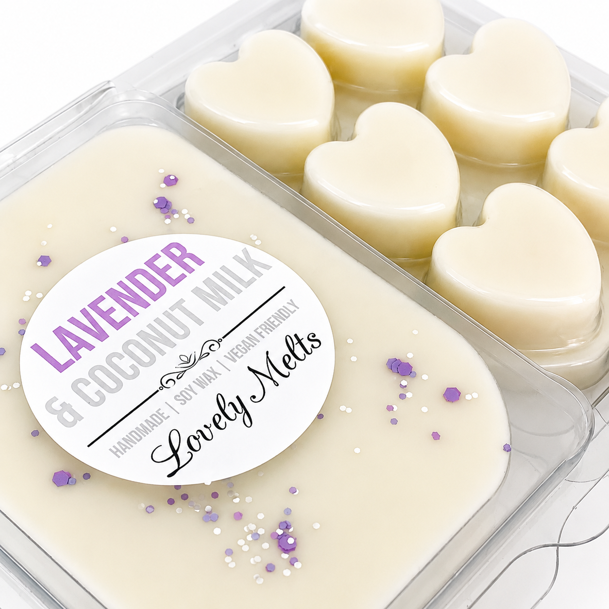 Heart-shaped lavender and coconut milkwax melts in a container with a 'Lovely Melts' label.