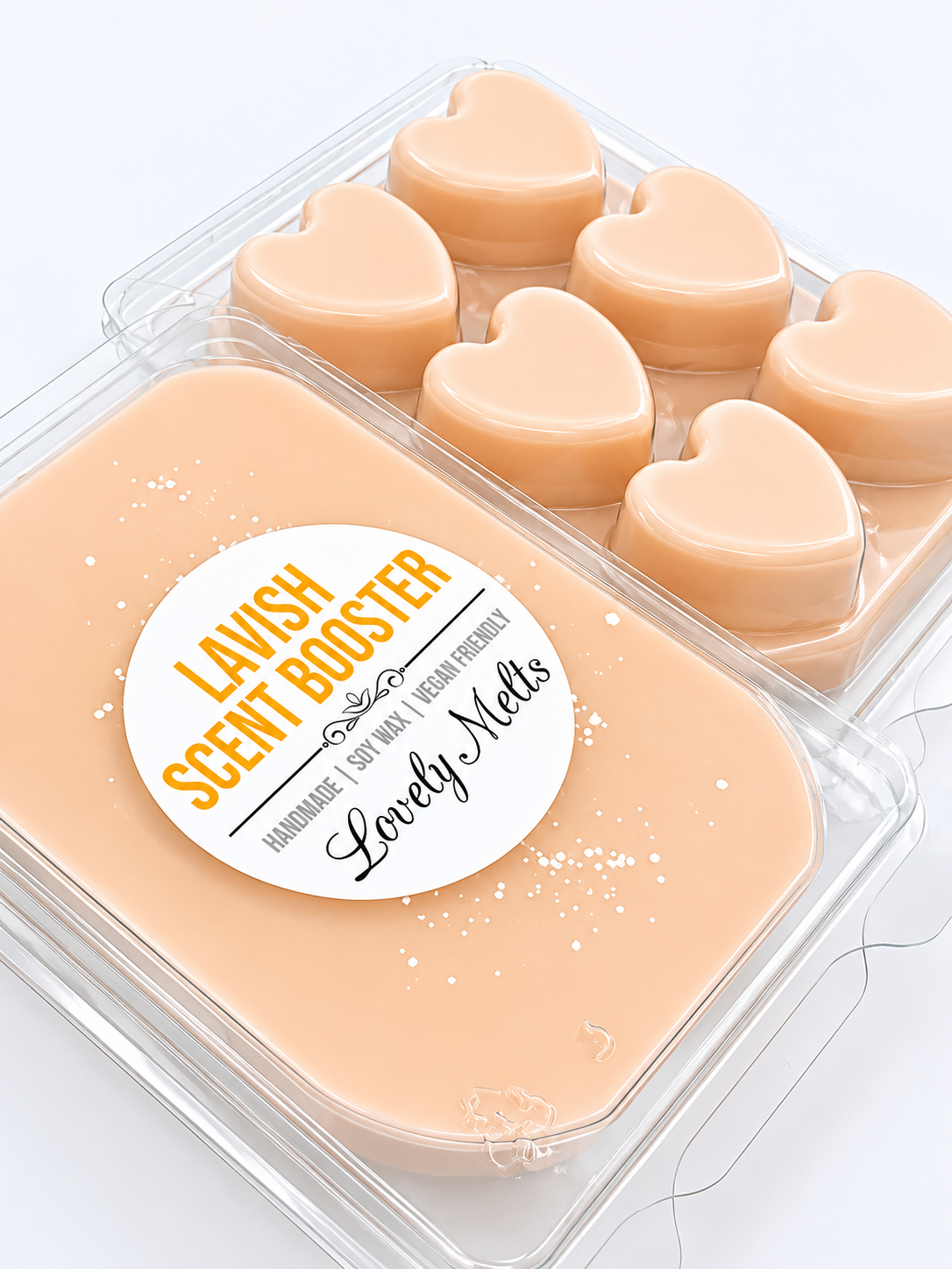 Heart-shaped wax melts in a clear container with a 'Lavish Scent Booster' label.