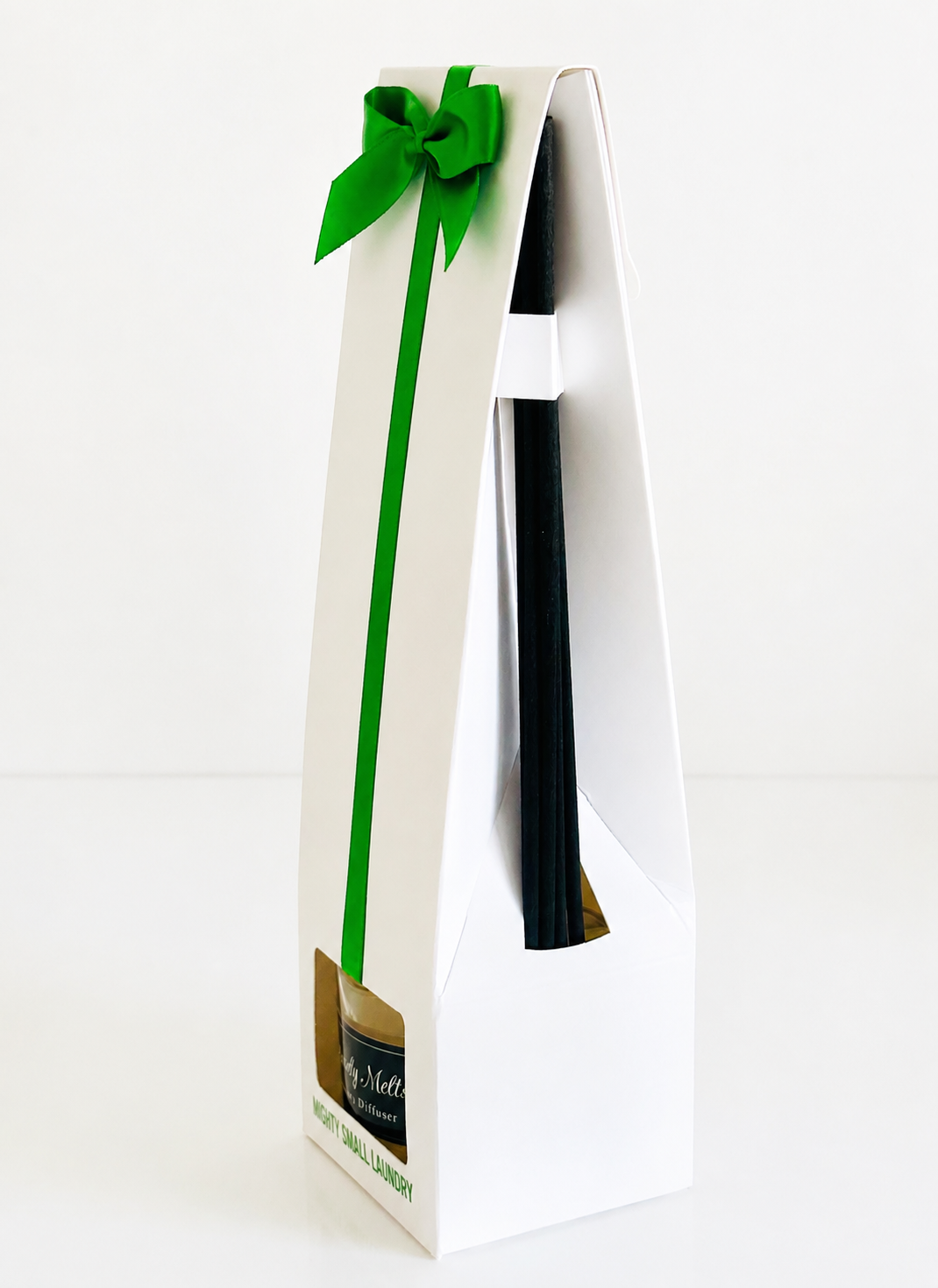 Gift box with a green ribbon on a white background