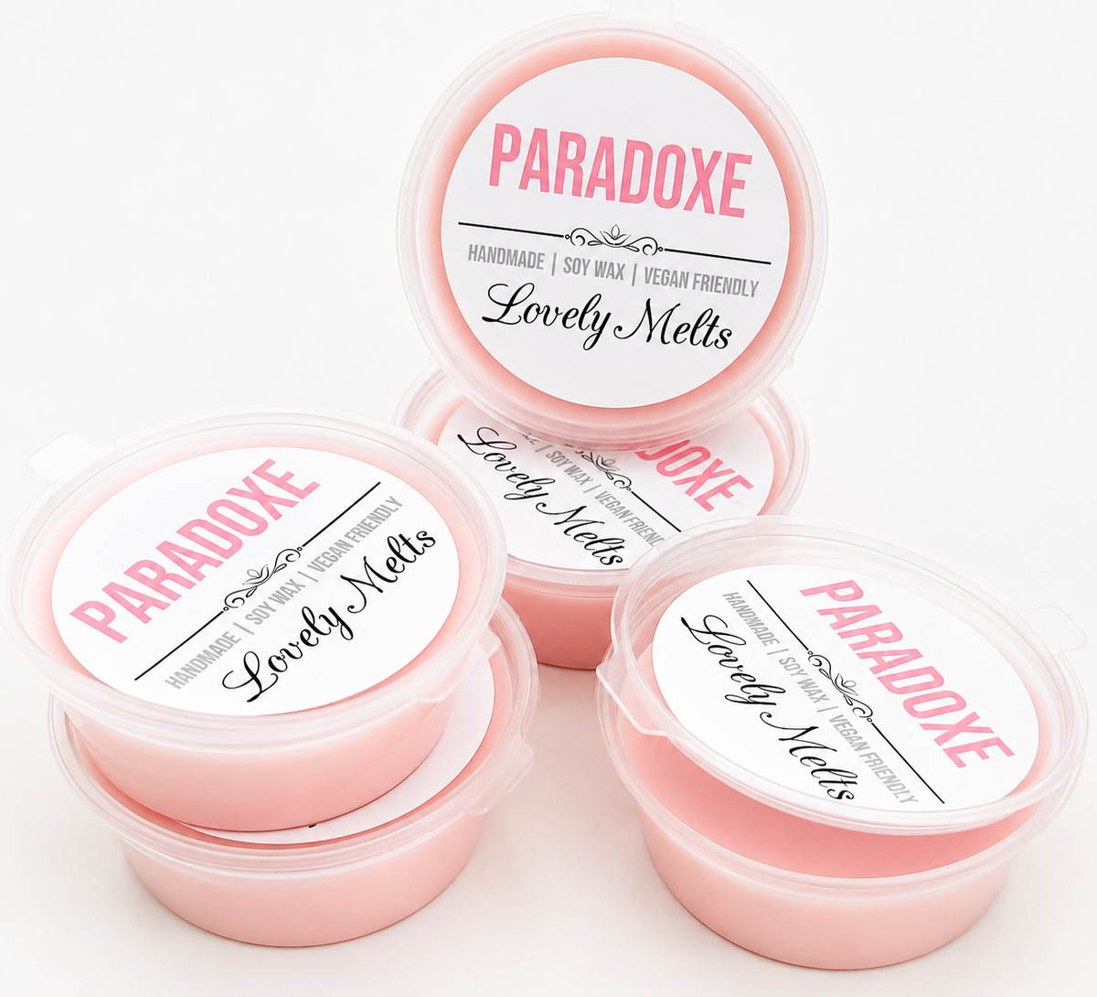 Four containers of Paradoxe Lovely Melts on a white background