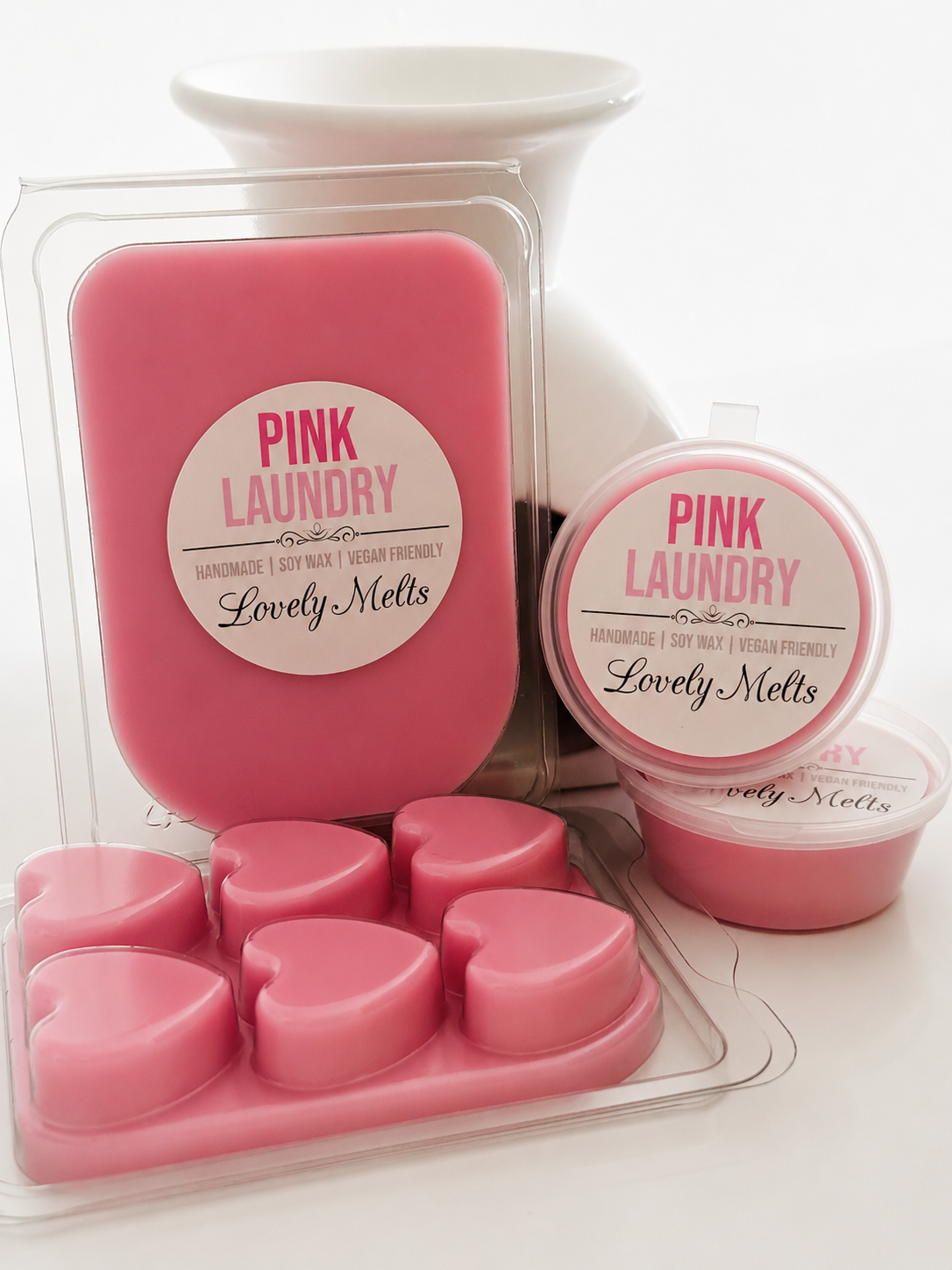 Pink laundry-themed wax melts packaging on a white background