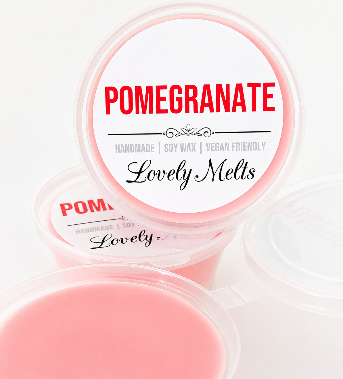 Pomegranate scented wax melts in a clear container with 'Lovely Melts' branding.