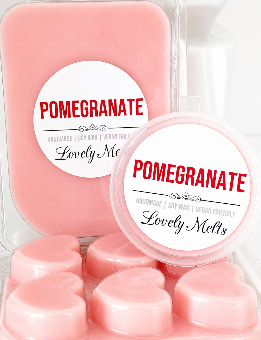 Pink wax melts in a container with 'Pomegranate' and 'Lovely Melts' labels.