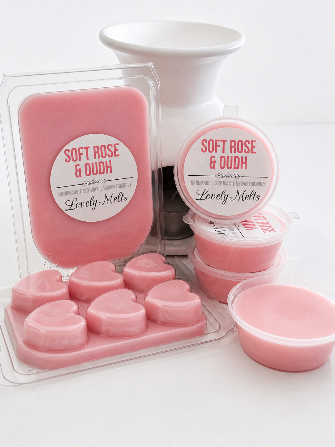 Pink wax melts packaging with 'Soft Rose & Oudh' label on a white background