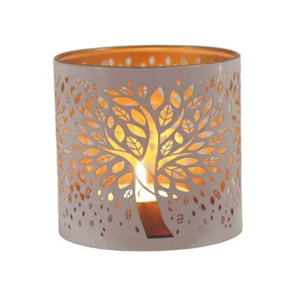 Decorative candle holder with tree design on a white background