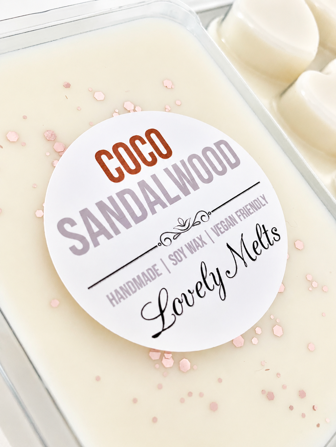Coco Sandalwood soy wax melts in a container with a label.