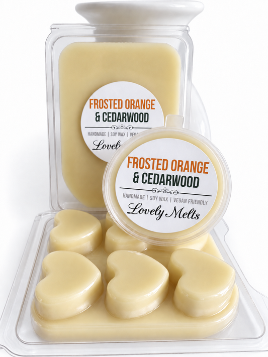 A product display of 'Frosted Orange & Cedarwood' scented soy wax melts by Lovely Melts. 