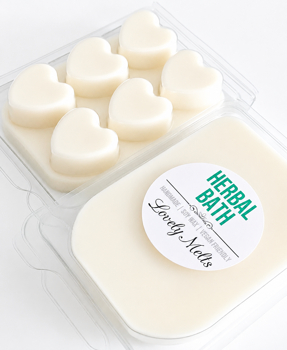 Heart-shaped herbal wax melts in a clear plastic container with a 'Herbal Bath' label.