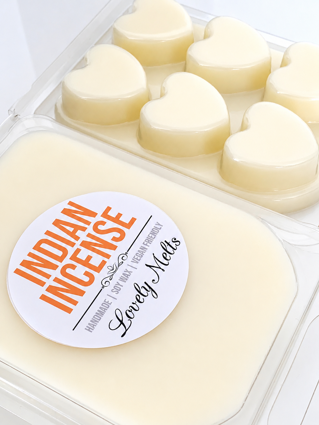 Heart-shaped wax melts in a container with 'Indian Incense' and 'Lovely Melts' branding.