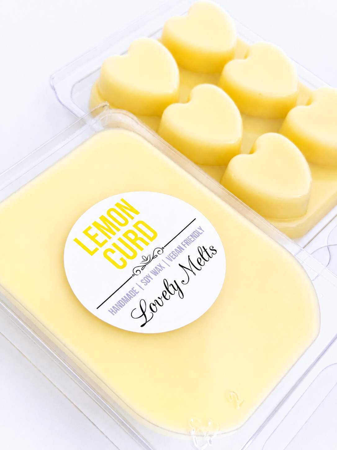 Heart-shaped lemon curd wax melts in a mold with a 'Lovely Melts' label.