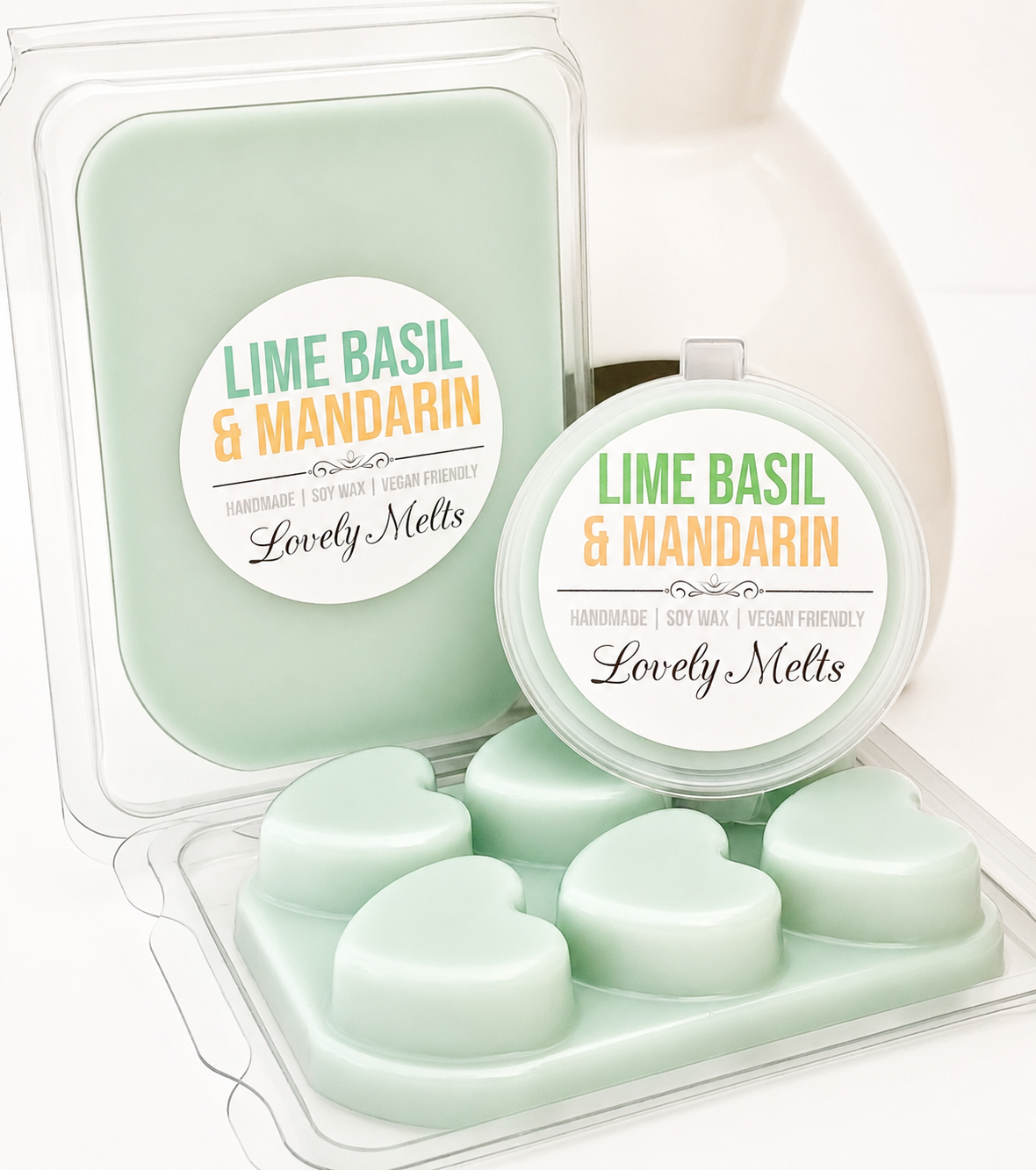 Heart-shaped lime basil and mandarin wax melts in packaging with 'Lovely Melts' branding.