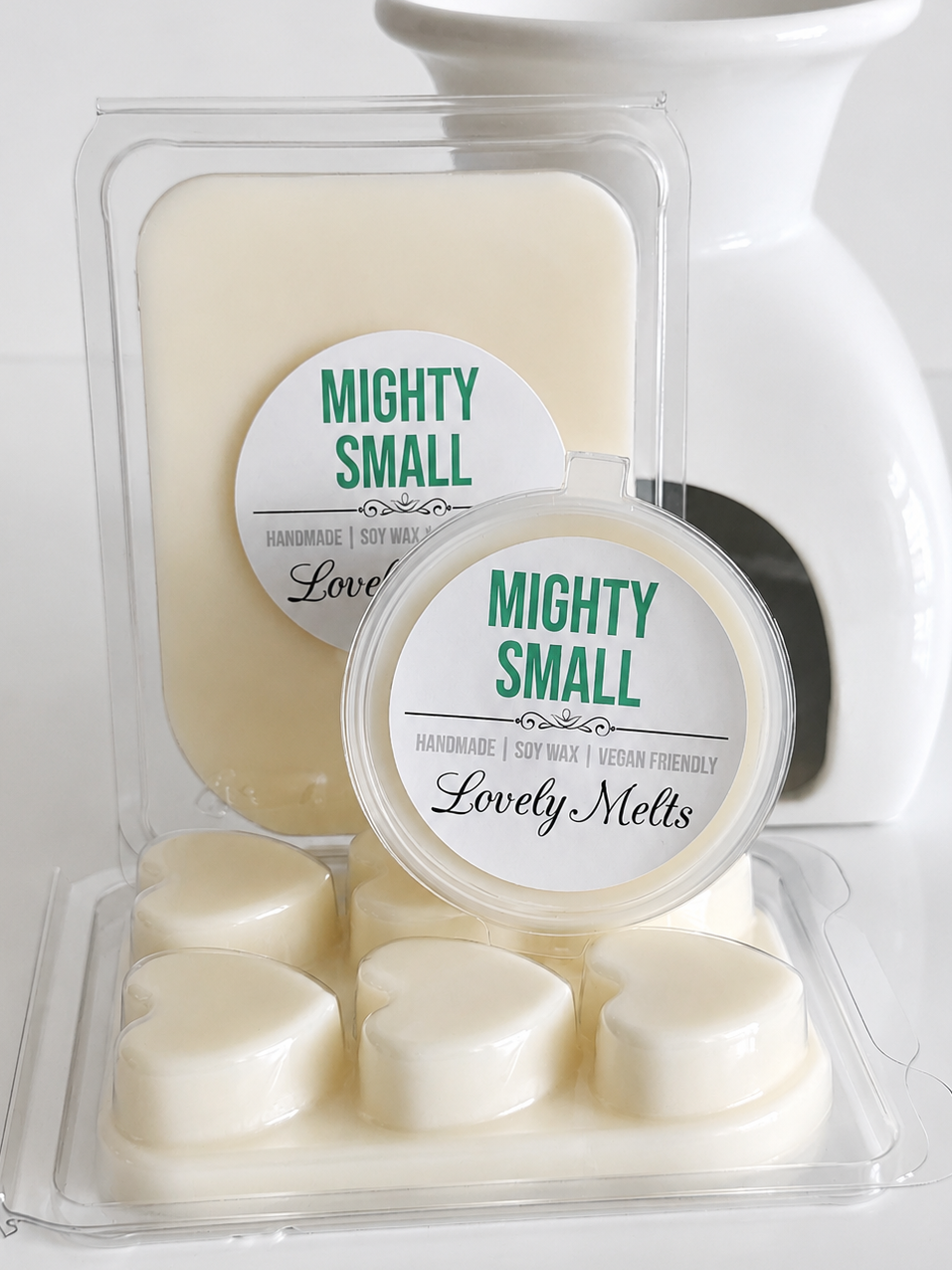 Packaged wax melts with 'Mighty Small' branding on a white background