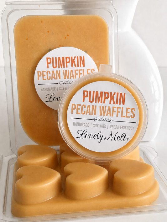 Pumpkin Pecan Waffles handmade soy wax melts by Lovely Mels, shown in a clear clamshell package and pot with a matching label, set against a white ceramic background.