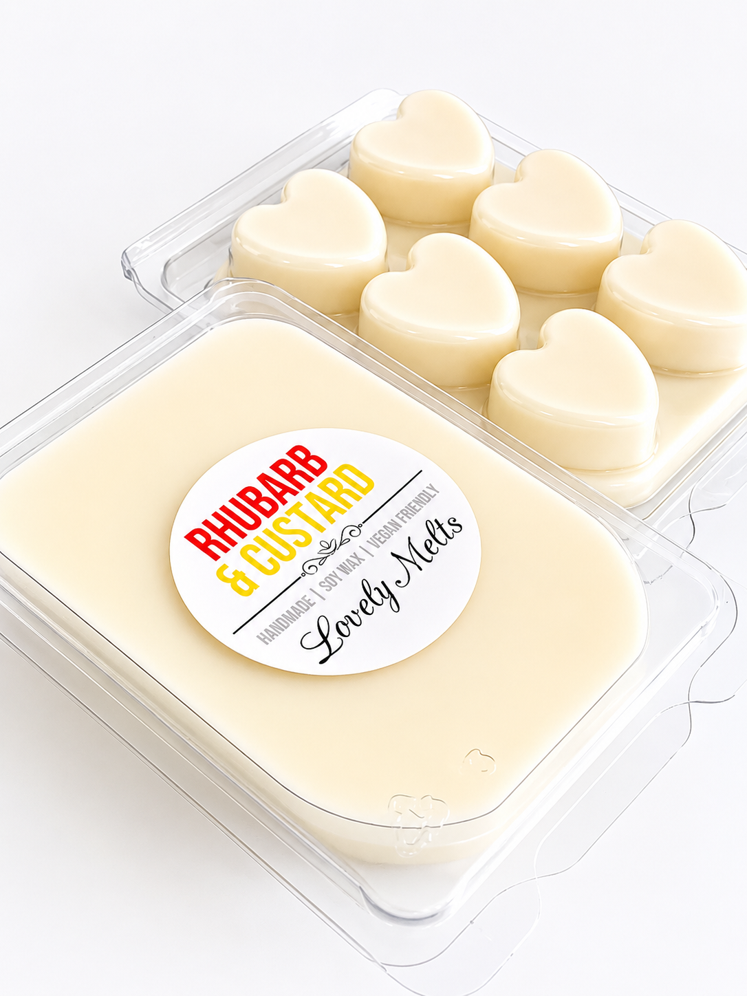 Heart-shaped wax melts in a container with a 'Rhubarb & Custard' label on a white background