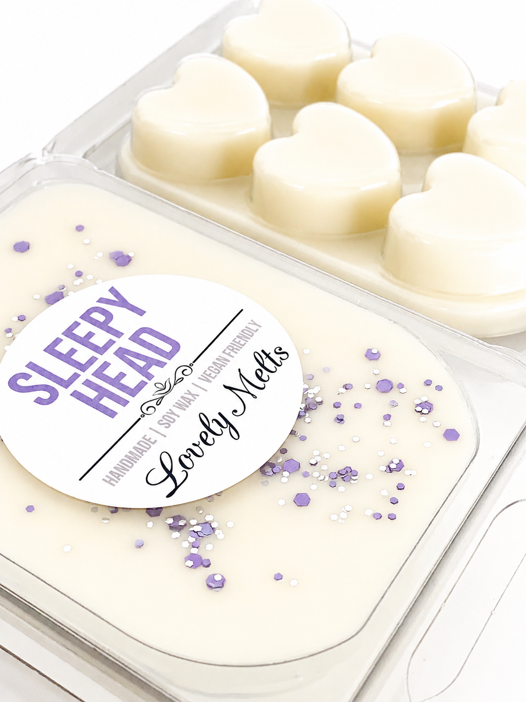 Packaged wax melts with 'Sleepy Head' label on a white background